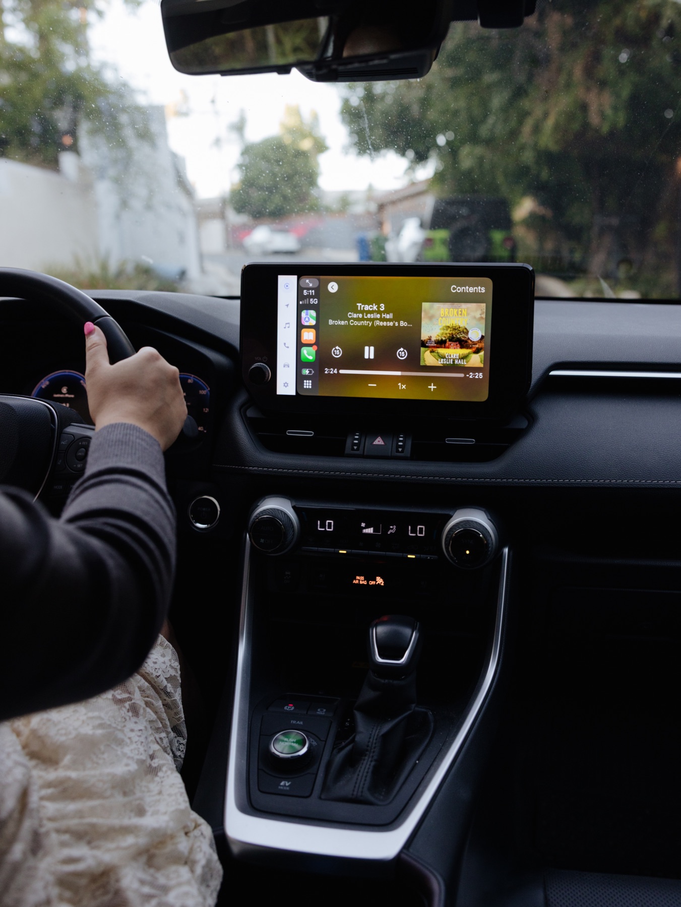 An Apple Books audiobook playing during a drive