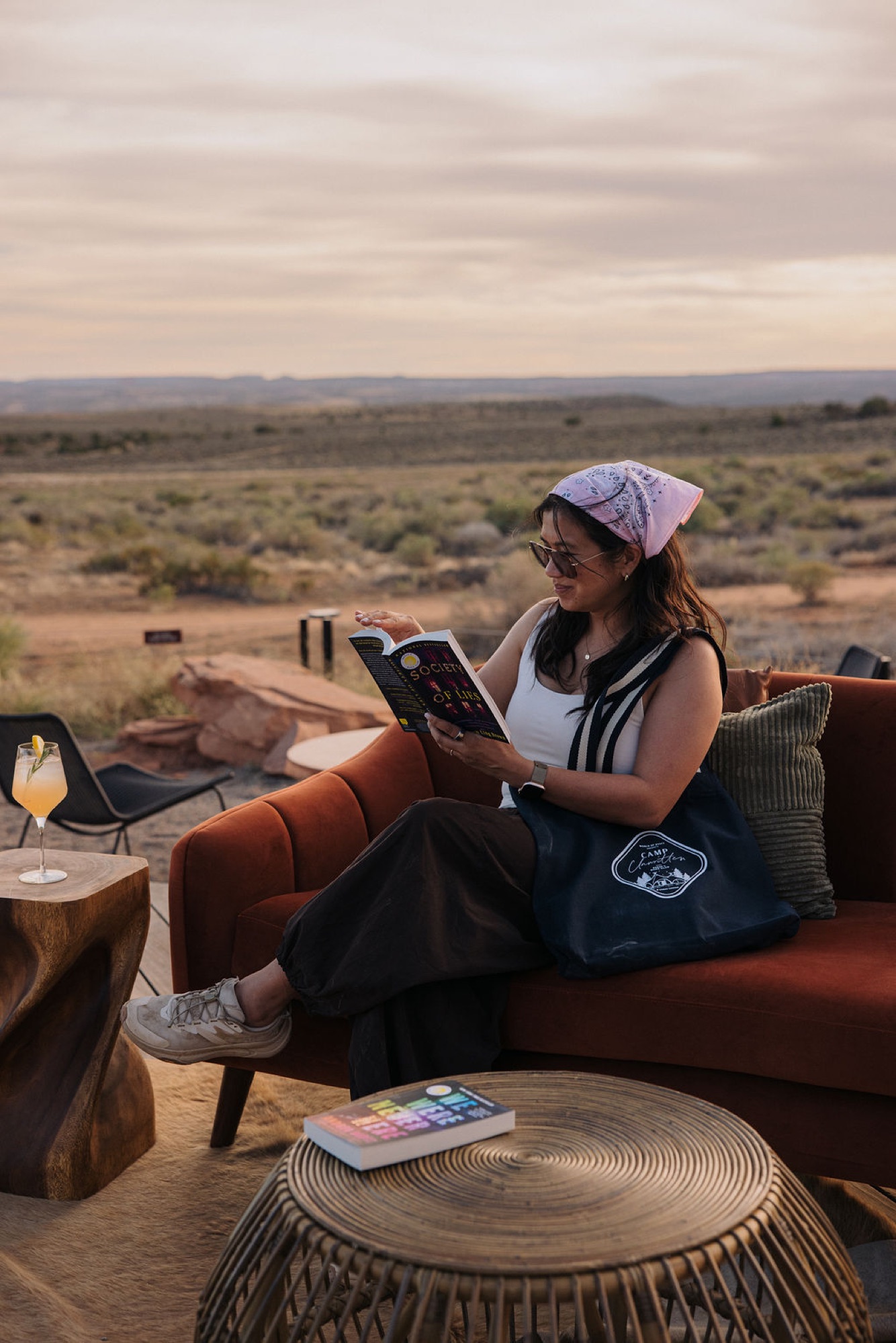 A guest reading outdoors at Camp Unwritten in Moab