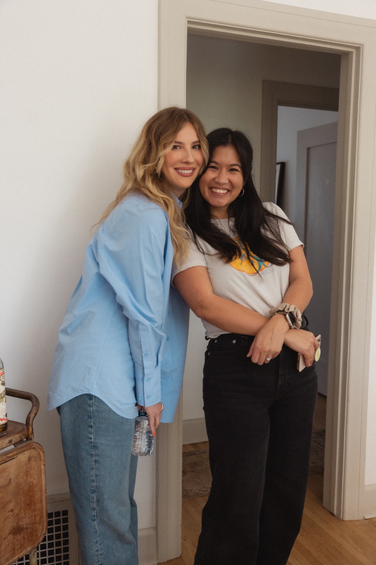 Emily Henry and Jane K Lee smiling together after the Lit Check shoot.