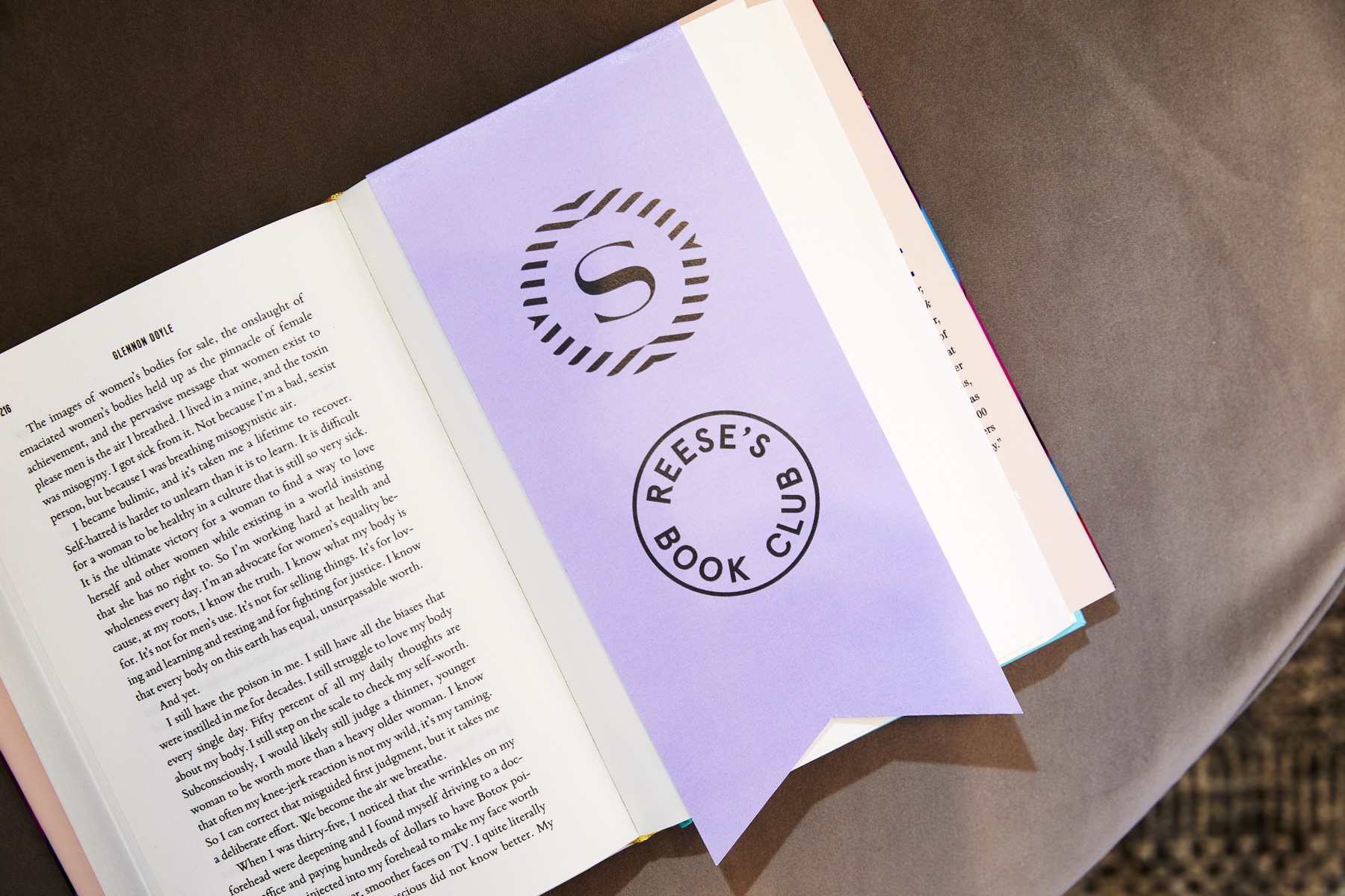 An open book with a Reese’s Book Club and Sheraton bookmark