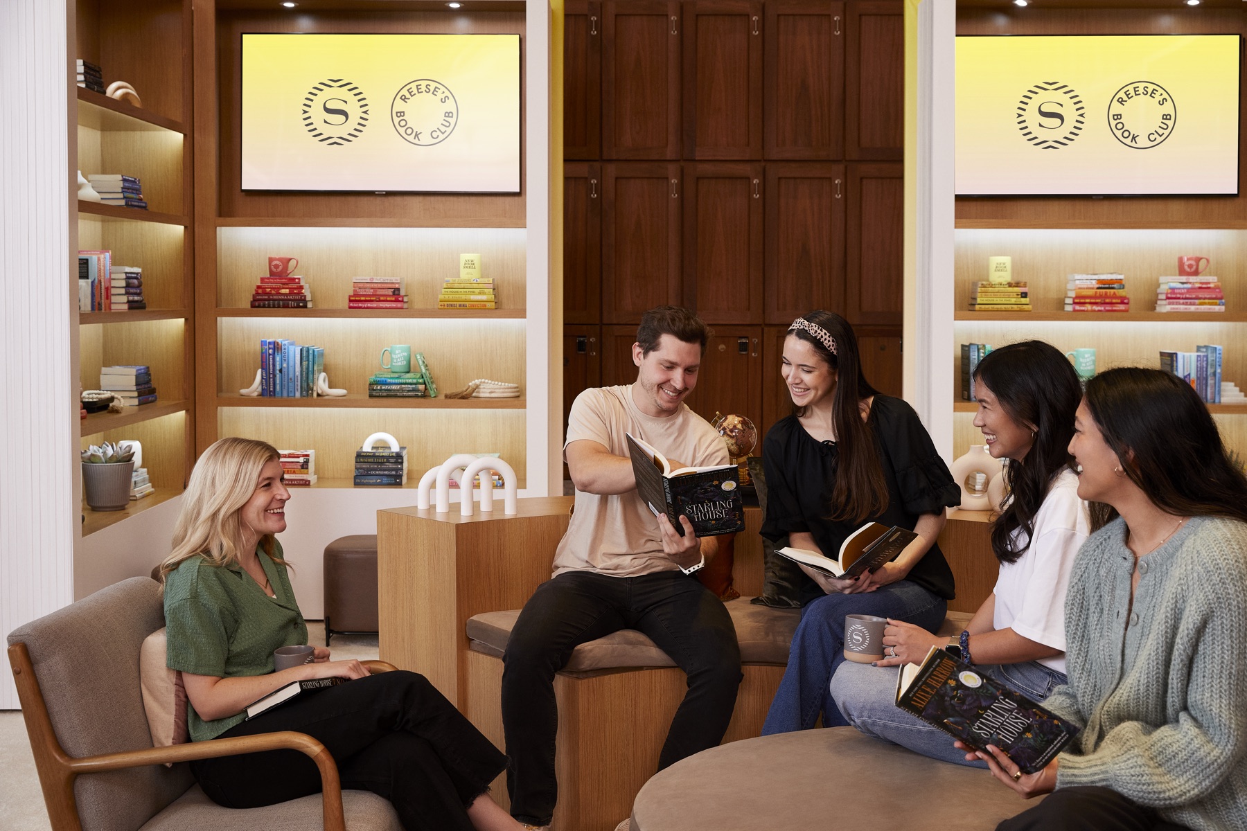 Readers gathering together with books inside the Lobby Library