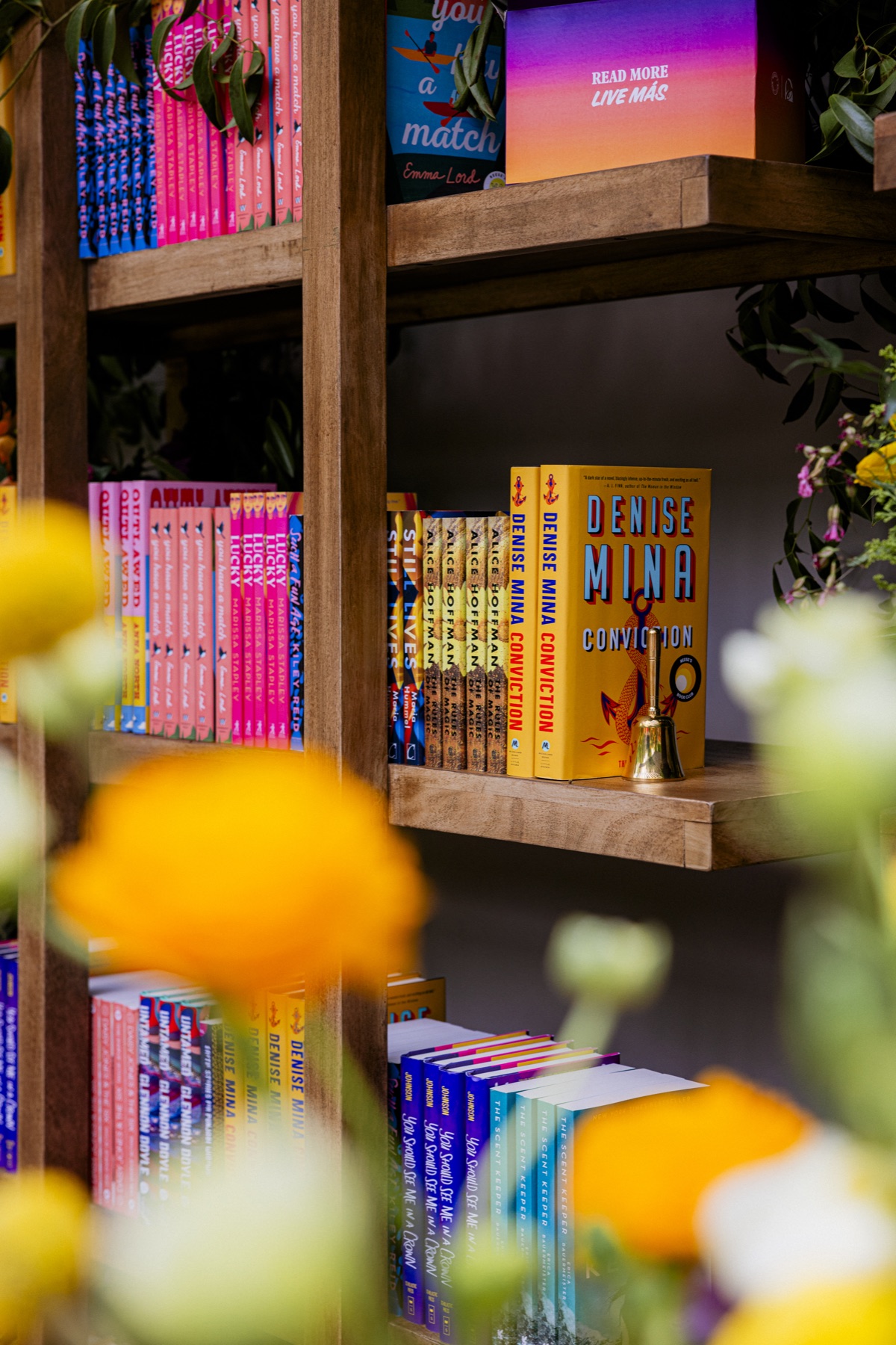Colorful Reese’s Book Club picks displayed with the campaign bell